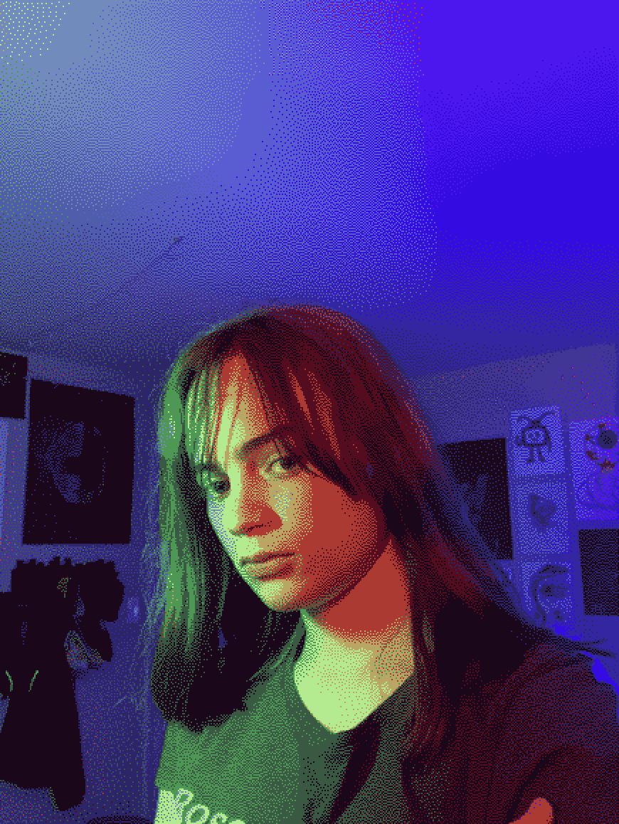 a pixelated, dithered photo of blue linden bathed in green light in a dark blue-colored bedroom.