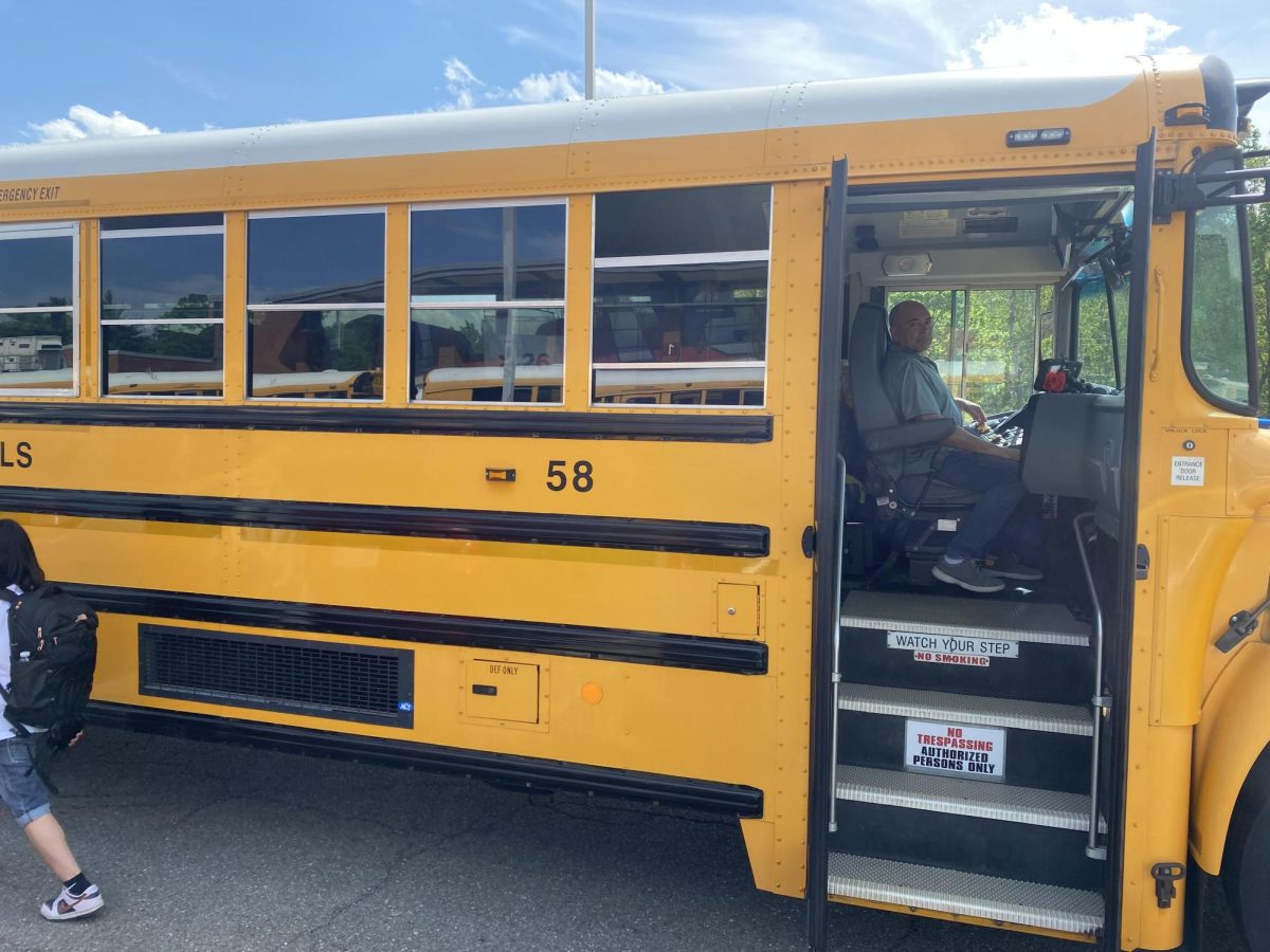 Driver John Jay Dolores with Bus 26
