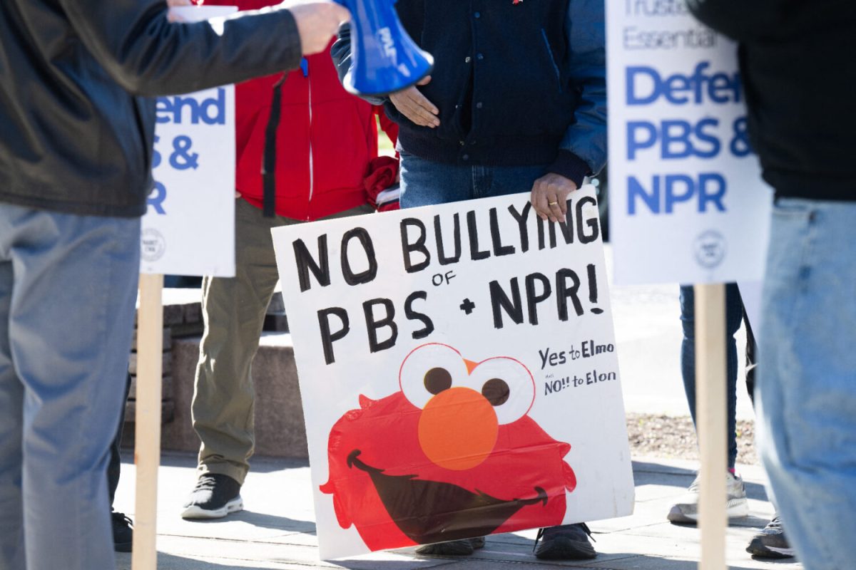 People participate in a rally to call on Congress to protect funding for US public broadcasters, Public Broadcasting Service (PBS) and National Public Radio (NPR), outside the NPR headquarters in Washington, DC, on March 26, 2025. President Donald Trump said on March 25 that he would "love" to cut funding for the US public broadcasters, which reportedly will be reviewed by Elon Musk's Department of Government Efficiency this week. (Photo by SAUL LOEB / AFP) (Photo by SAUL LOEB/AFP via Getty Images)